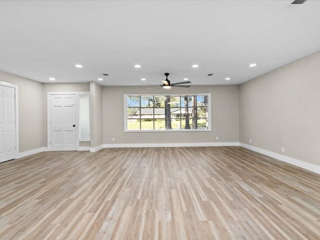 unfurnished living room with light hardwood / wood-style flooring and ceiling fan