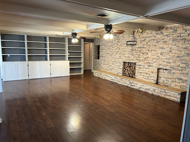 unfurnished living room with visible vents, a ceiling fan, dark wood finished floors, and beam ceiling