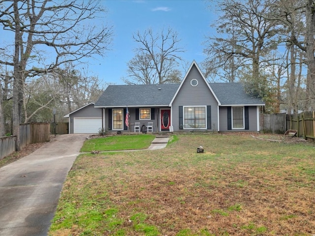 single story home featuring a garage and a front lawn