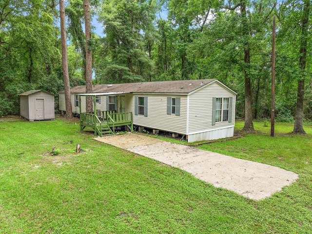 back of property with a storage shed and a yard