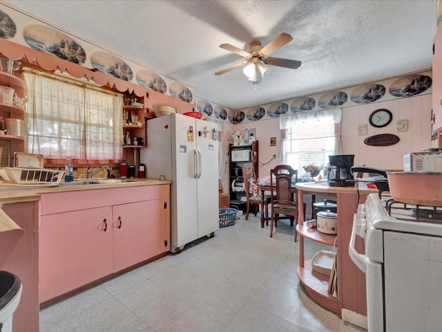 309 County Barn Rd, Lufkin, TX 75904 - kitchen featuring white appliances, open shelves, ceiling fan, a textured ceiling, and light countertops