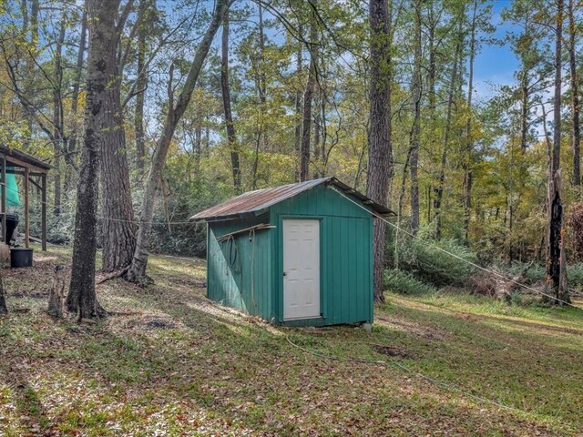 309 County Barn Rd, Lufkin, TX 75904 - view of shed with a view of trees