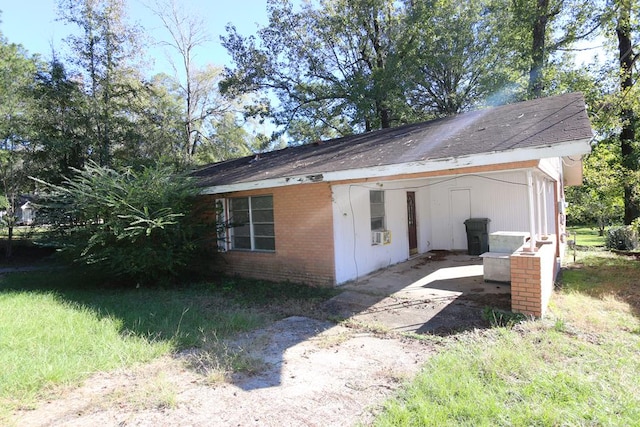 view of side of home featuring cooling unit