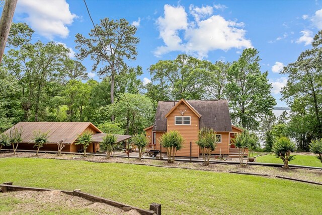 183 Holly Cir, Etoile, TX 75944 - view of grassy yard with a deck