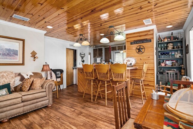 183 Holly Cir, Etoile, TX 75944 - dining area with wood finished floors and ornamental molding
