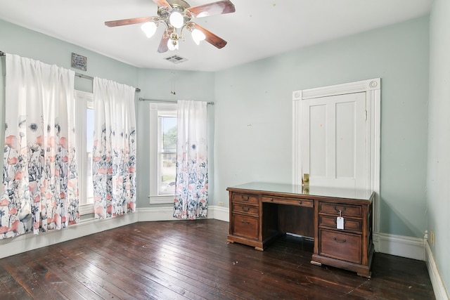 unfurnished office featuring ceiling fan and dark hardwood / wood-style flooring