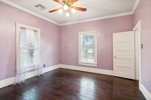 spare room with ornamental molding, plenty of natural light, dark wood-type flooring, and ceiling fan