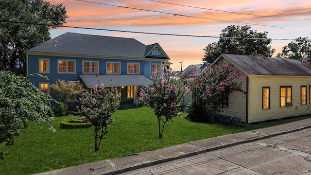 view of front of property with a lawn