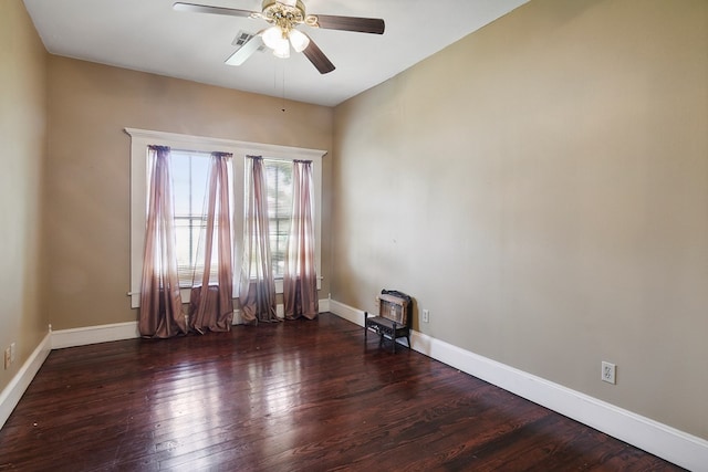 spare room with ceiling fan and dark hardwood / wood-style flooring