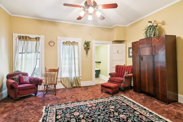 living area with crown molding, carpet, and ceiling fan