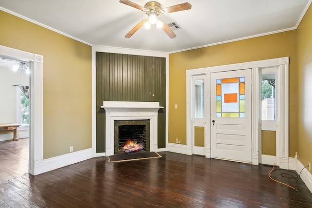 unfurnished living room featuring ceiling fan, ornamental molding, and dark hardwood / wood-style flooring