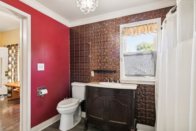 bathroom with toilet, crown molding, an inviting chandelier, wood-type flooring, and vanity