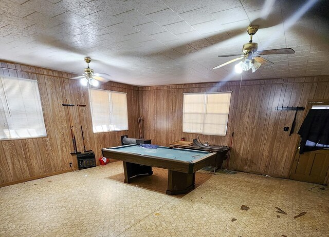 recreation room featuring wooden walls, ceiling fan, and pool table