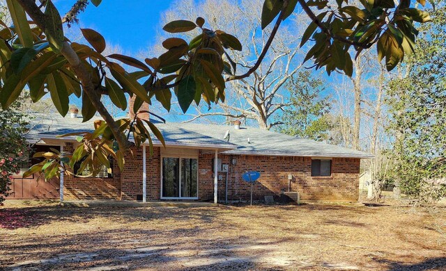 rear view of house with central air condition unit