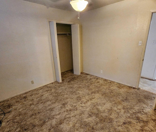 unfurnished bedroom with a closet and carpet