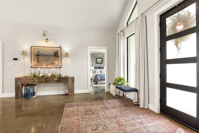 entrance foyer with vaulted ceiling