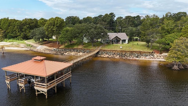 dock area featuring a water view and a yard