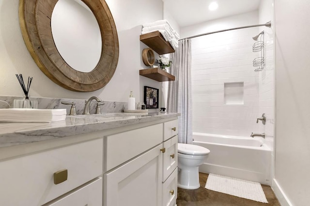 full bathroom featuring shower / bath combo, toilet, and vanity