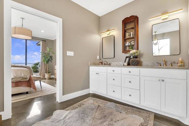 bathroom featuring vanity and concrete flooring