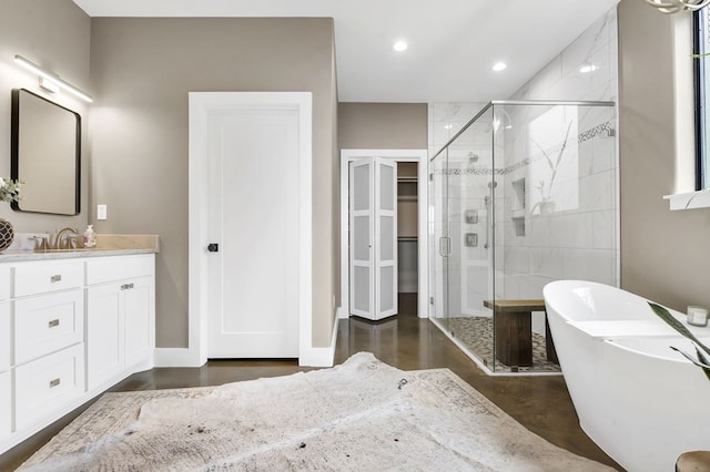 bathroom featuring vanity, plus walk in shower, and concrete floors