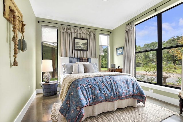 bedroom with concrete floors and ornamental molding