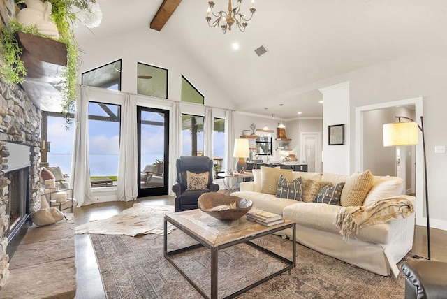 living room featuring beam ceiling, high vaulted ceiling, a notable chandelier, wood-type flooring, and a fireplace