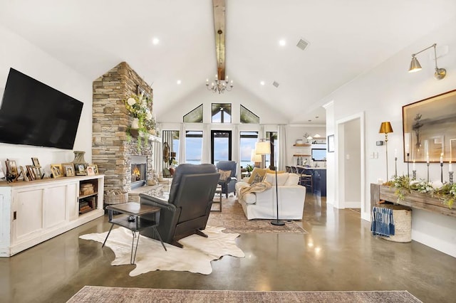 living room with vaulted ceiling with beams, concrete flooring, a fireplace, and an inviting chandelier