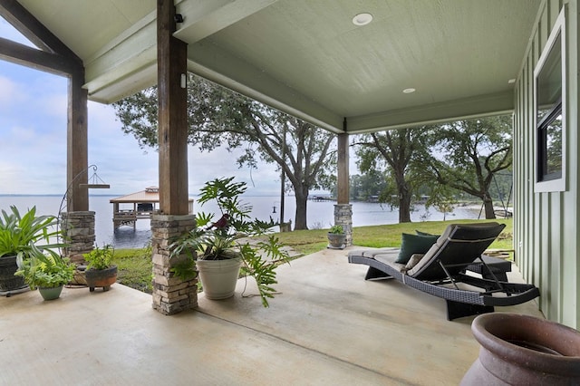 view of patio / terrace with a gazebo and a water view