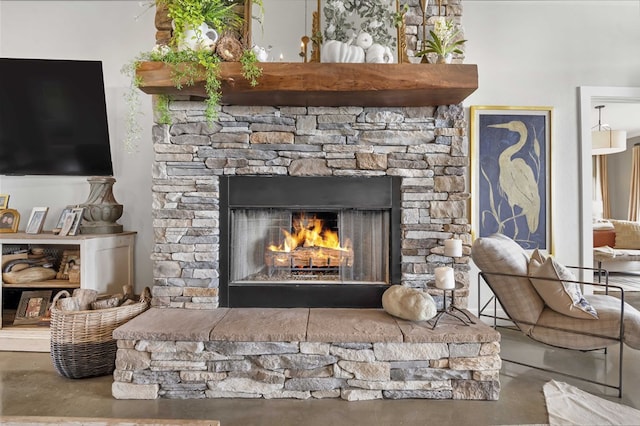 details featuring a fireplace and concrete flooring