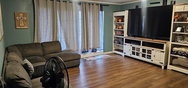 living room featuring hardwood / wood-style flooring and ornamental molding