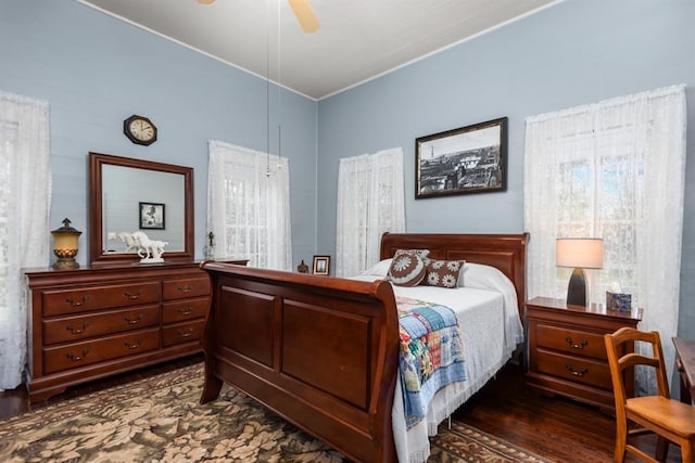 bedroom featuring ceiling fan and dark wood-type flooring