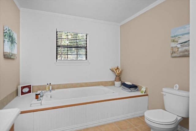 bathroom featuring a bathtub, toilet, tile patterned flooring, and ornamental molding