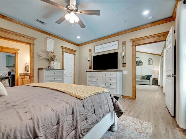 bedroom with ornamental molding, light wood-type flooring, ceiling fan, ensuite bathroom, and visible vents