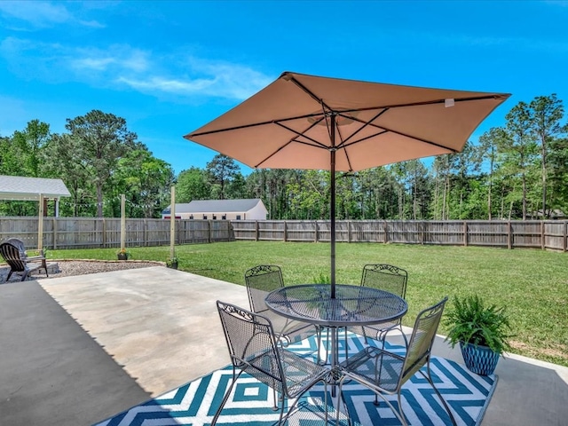 1003 Holubec St, Diboll, TX 75941 - view of patio / terrace featuring outdoor dining area and view of wooded area