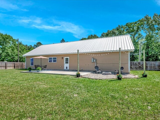 1003 Holubec St, Diboll, TX 75941 - back of property with a patio and metal roof