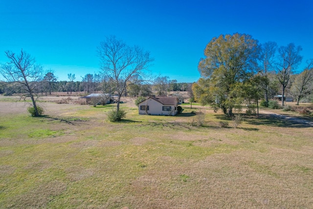view of yard with a rural view