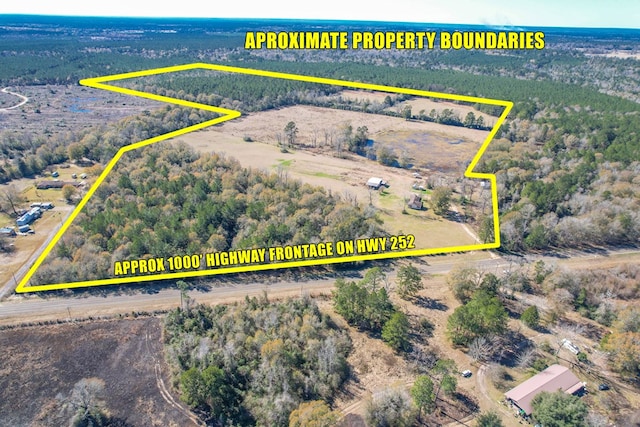 birds eye view of property featuring a rural view