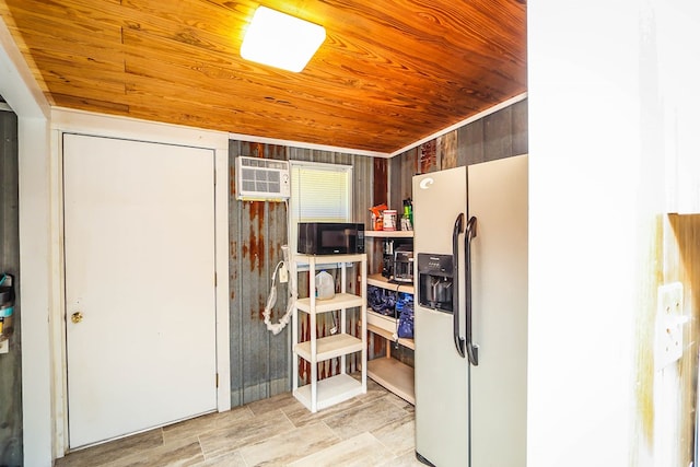 496 County Road 486, Broaddus, TX 75929 - kitchen with white refrigerator with ice dispenser, wood ceiling, black microwave, and a wall mounted AC