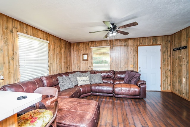 496 County Road 486, Broaddus, TX 75929 - living area featuring ceiling fan, wood finished floors, wood walls, and baseboards