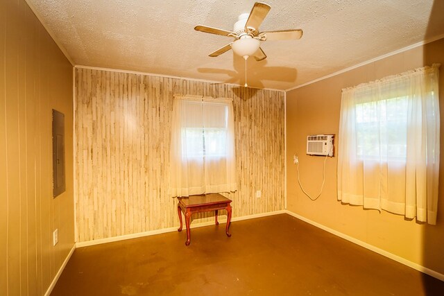 496 County Road 486, Broaddus, TX 75929 - unfurnished room with wood walls, a wall mounted AC, a textured ceiling, baseboards, and a ceiling fan