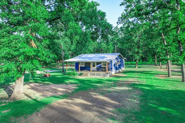 496 County Road 486, Broaddus, TX 75929 - view of property's community with a lawn