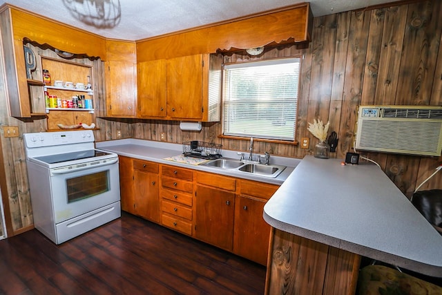 496 County Road 486, Broaddus, TX 75929 - kitchen with electric stove, a sink, light countertops, dark wood-style flooring, and brown cabinets