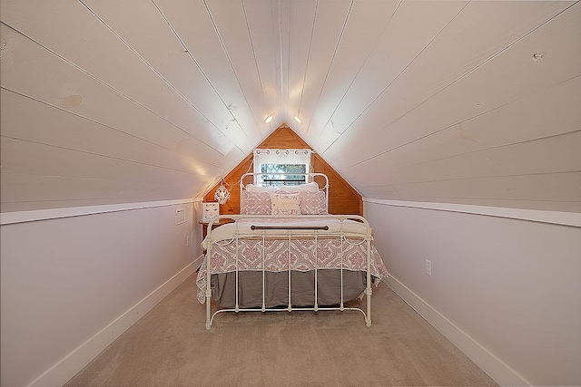 bedroom featuring carpet flooring and lofted ceiling