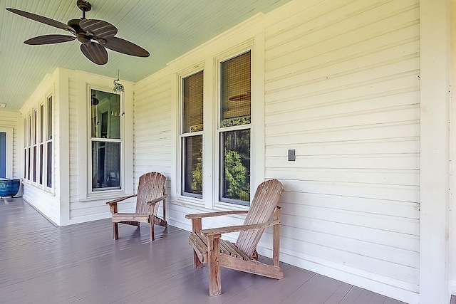 wooden deck featuring ceiling fan and covered porch