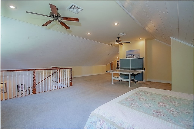 bedroom featuring ceiling fan, light colored carpet, and lofted ceiling