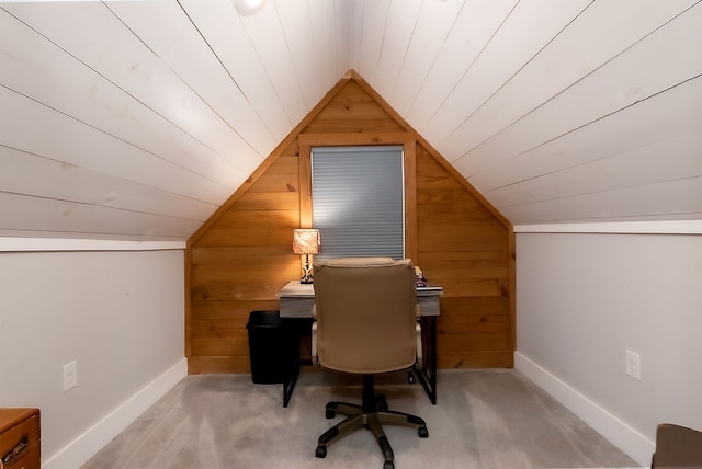 carpeted office with wooden ceiling, wooden walls, and vaulted ceiling