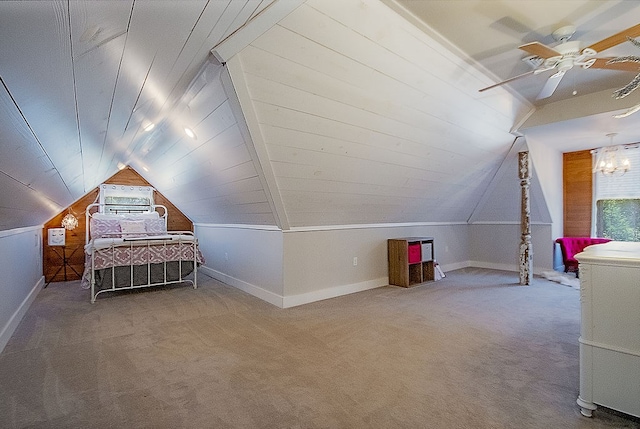 unfurnished bedroom featuring carpet flooring, ceiling fan, and vaulted ceiling