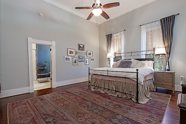 bedroom with ceiling fan, ornamental molding, and dark wood-type flooring