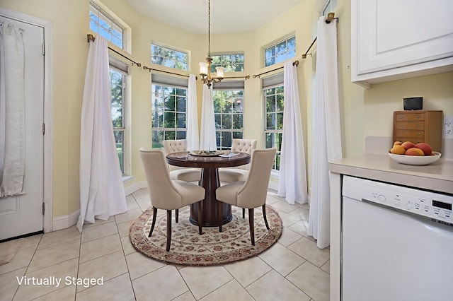 120 Shady Springs Bnd, Lufkin, TX 75901 - dining room featuring a chandelier, light tile patterned floors, and a towering ceiling