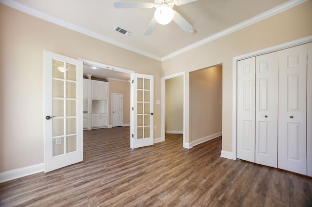 120 Shady Springs Bnd, Lufkin, TX 75901 - unfurnished bedroom with french doors, ornamental molding, dark wood finished floors, a closet, and a ceiling fan